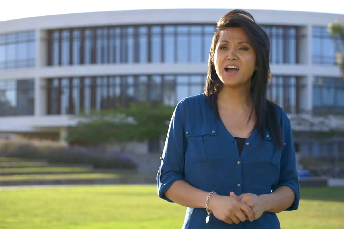 A student speaking in front of the Hannon Library